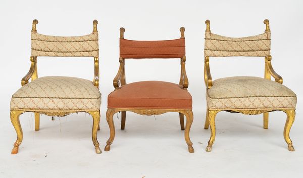 A PAIR OF REGENCY GILT-WOOD SCROLL ARMCHAIRS (3)