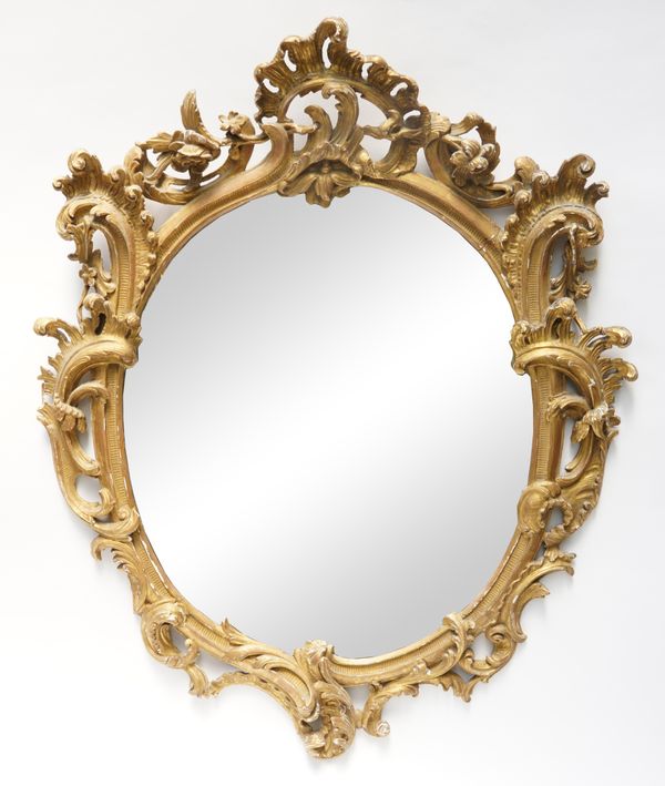 A GEORGE III ROCOCO REVIVAL GILT-WOOD AND GESSO OVAL MIRROR