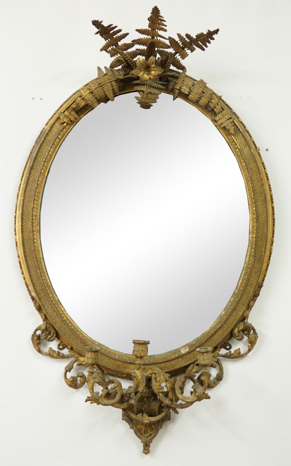 A VICTORIAN GILT FRAMED OVAL GIRANDOLE MIRROR