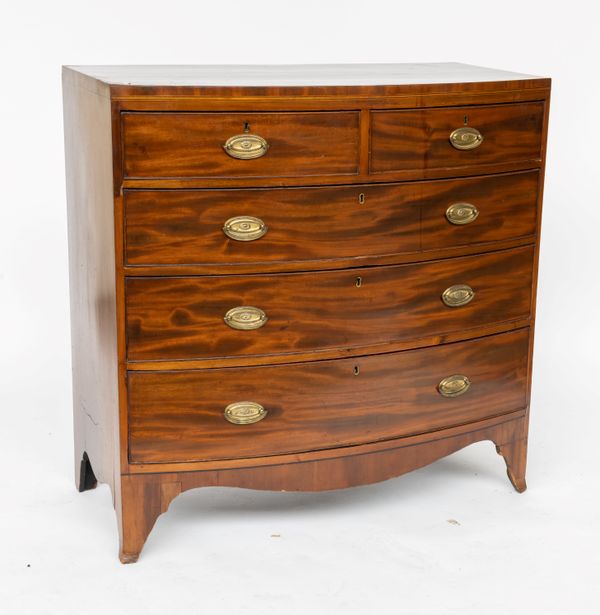 A REGENCY  MAHOGANY BOW FRONT CHEST ON SPLAYED BRACKET FEET