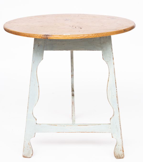 A CIRCULAR PINE CRICKET TABLE ON BLUE PAINTED SILHOUETTE BASE