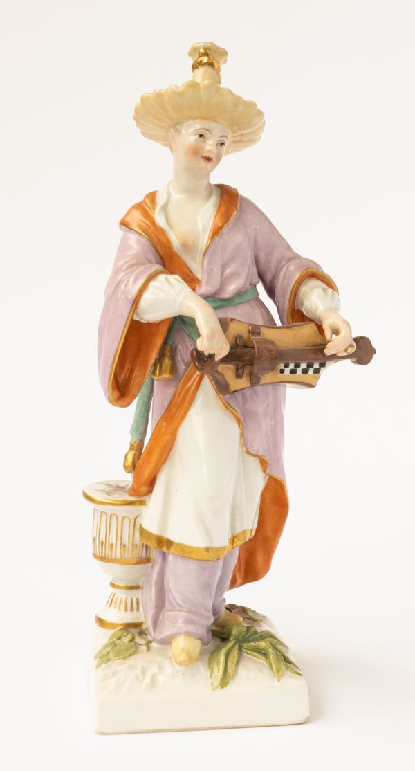 A BERLIN PORCELAIN FIGURE OF A FEMALE MALABAR MUSICIAN