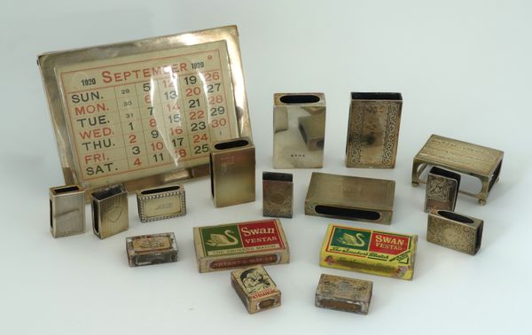 A SILVER MOUNTED DESK CALENDAR AND ELEVEN MATCHBOX SLEEVES (12)