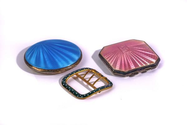 TWO SILVER AND ENAMELLED POWDER COMPACTS AND A GILT METAL AND ENAMELLED BUCKLE (3)