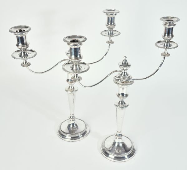 A PAIR OF PLATED ON COPPER TWIN LIGHT TABLE CANDELABRA