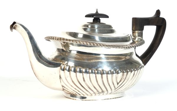 A SILVER TEAPOT