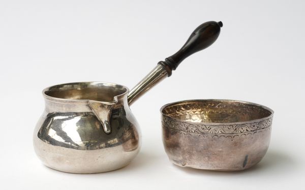 AN EARLY GEORGE II SILVER BRANDY SAUCEPAN AND A FOREIGN BOWL (2)