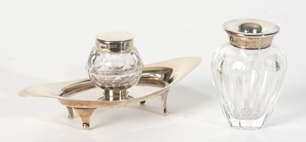 A SILVER MOUNTED AND CUT GLASS NAVETTE SHAPED INKWELL AND STAND AND A VASE (2)