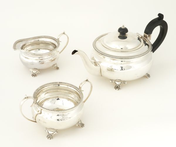 A SILVER THREE PIECE TEA SET