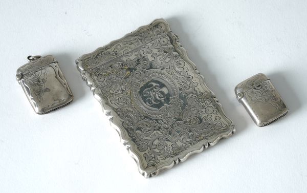 A SILVER VISITING CARD CASE AND TWO SILVER VESTA CASES (3)