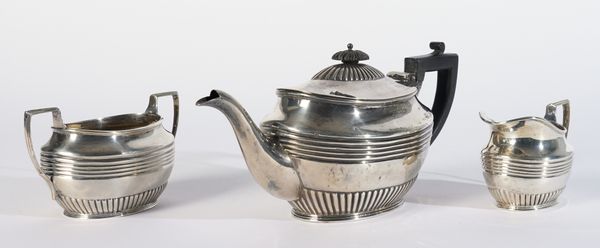 A LATE VICTORIAN SILVER THREE PIECE TEA SET