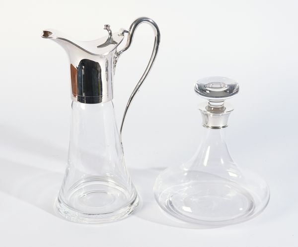 A SILVER MOUNTED CLARET JUG AND A SILVER MOUNTED DECANTER (2)