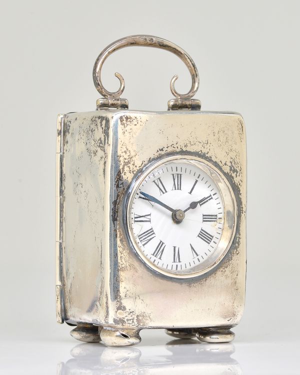 A SILVER CASED RECTANGULAR SMALL CARRIAGE CLOCK TIMEPIECE