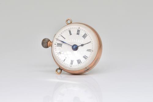 A GILT METAL SPHERICAL PENDANT WATCH