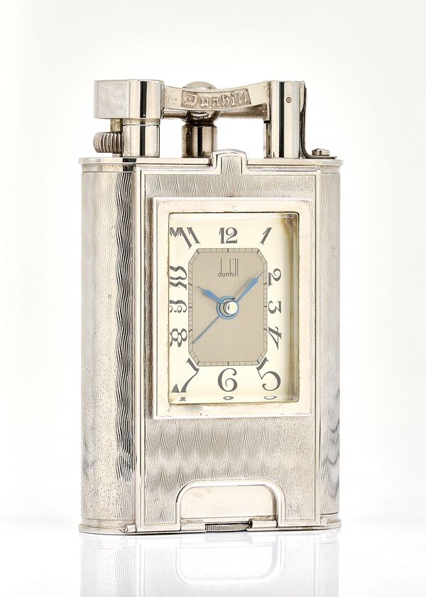 A CHROME PLATED METAL DUNHILL OVERSIZED CLOCK TABLE LIGHTER