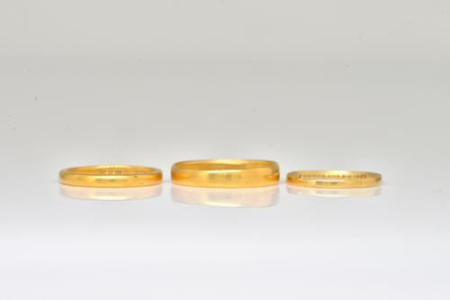 THREE GOLD WEDDING RINGS (3)
