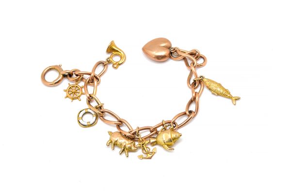 A 9CT GOLD CHARM BRACELET