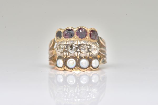 A GOLD, DIAMOND, GARNET AND HALF PEARL SET RING