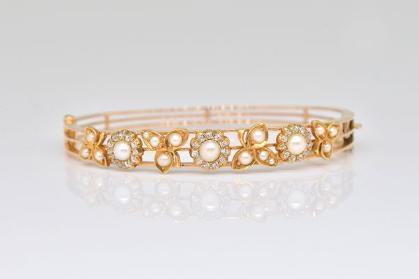 A GOLD, CULTURED PEARL AND DIAMOND OVAL HINGED BANGLE