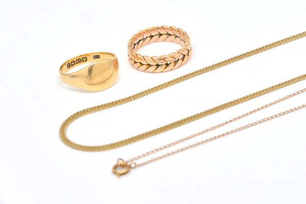 AN 18CT GOLD SIGNET RING, TWO GILT METAL NECKCHAINS, AND ANOTHER GOLD RING (4)