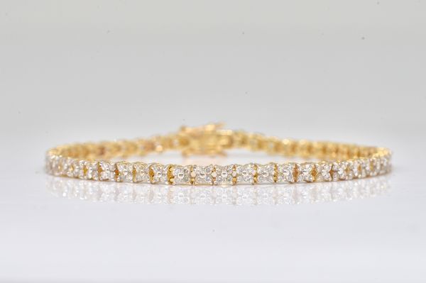 A 9CT GOLD AND DIAMOND BRACELET