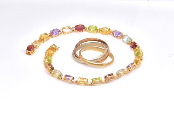 A GOLD AND GEMSTONE SET BRACELET AND A RING (2)