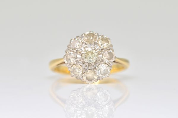 A GOLD AND DIAMOND NINE STONE CLUSTER RING