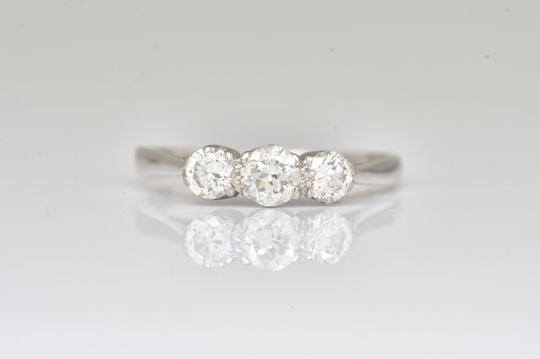 A WHITE GOLD AND DIAMOND THREE STONE RING