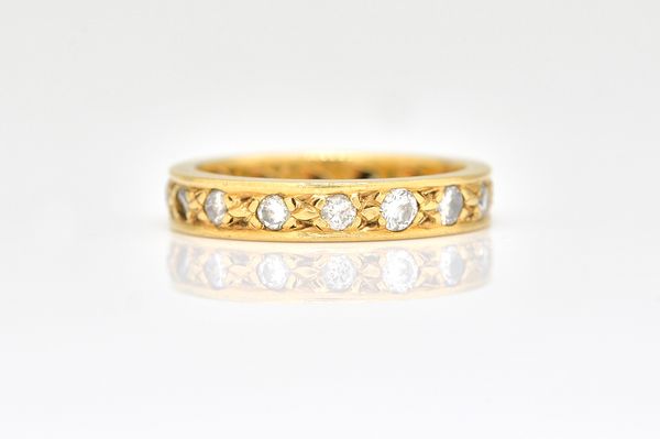 A YELLOW GOLD AND DIAMOND FULL ETERNITY RING,