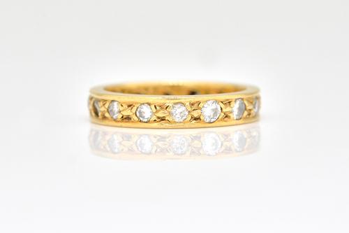 A YELLOW GOLD AND DIAMOND FULL ETERNITY RING,