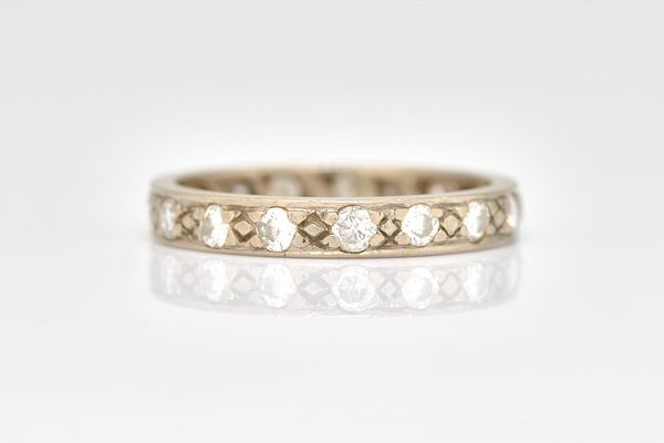 A WHITE GOLD AND DIAMOND FULL ETERNITY RING