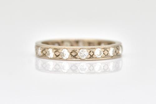 A WHITE GOLD AND DIAMOND FULL ETERNITY RING