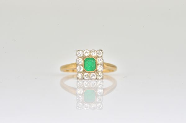 A GOLD, EMERALD AND DIAMOND RECTANGULAR CLUSTER RING