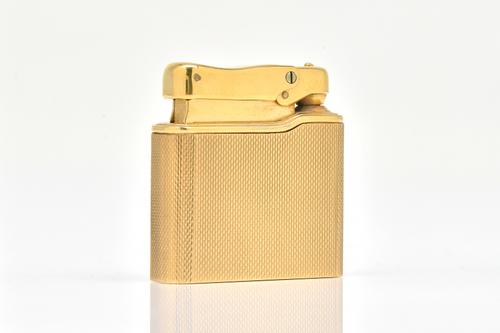 A 9CT GOLD CASED COLIBRI LIGHTER