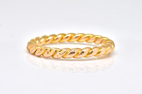 A FRENCH GOLD OVAL HINGED BANGLE
