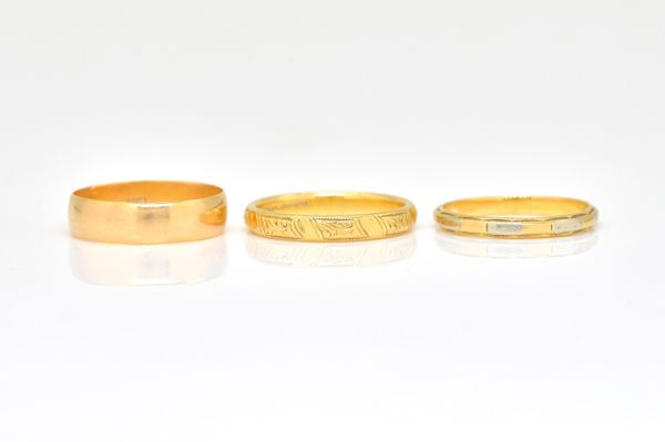 THREE GOLD WEDDING RINGS (3)