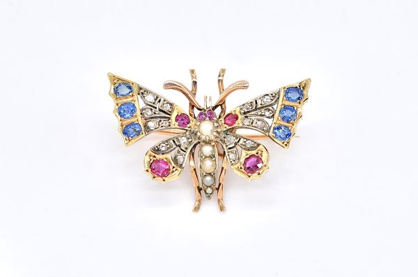 A DIAMOND, RUBY, SAPPHIRE AND HALF PEARL SET BUTTERFLY BROOCH