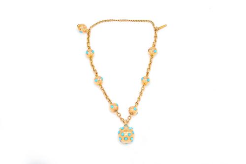 A GOLD AND TURQUOISE BRACELET