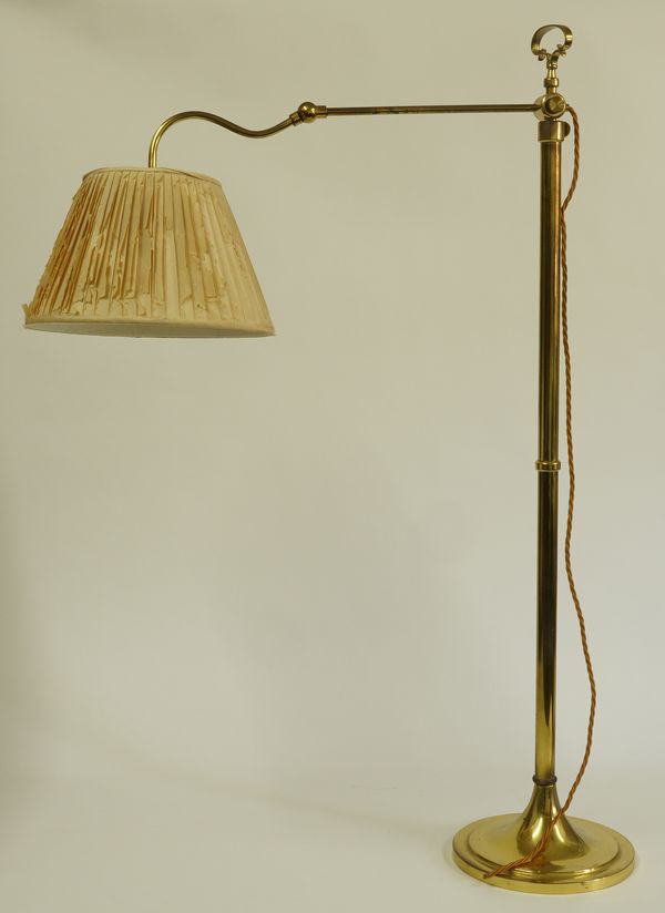 A MODERN BRASS ADJUSTABLE FLOOR STANDING READING LIGHT