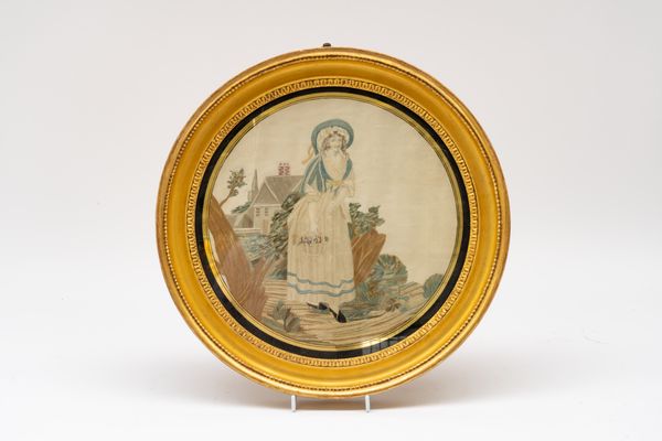 A REGENCY SILK-WORK PANEL OF A YOUNG WOMAN WITH A BASKET OF FLOWERS