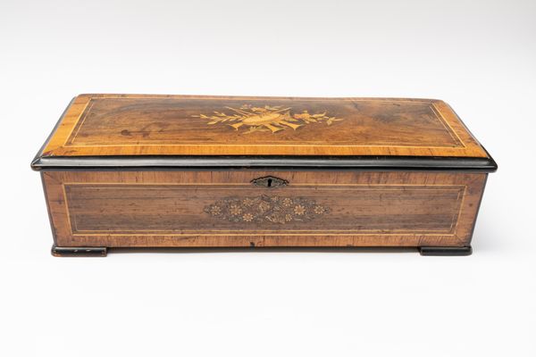 A SWISS ROSEWOOD, EBONISED AND MARQUETRY CYLINDER MUSIC BOX