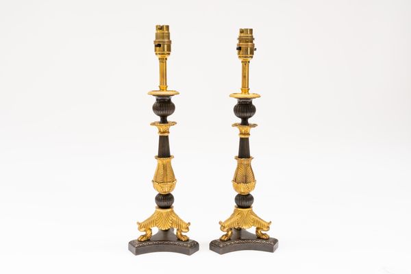 A PAIR OF FRENCH RESTAURATION STYLE GILT AND PATINATED BRONZE TABLE LAMPS (2)