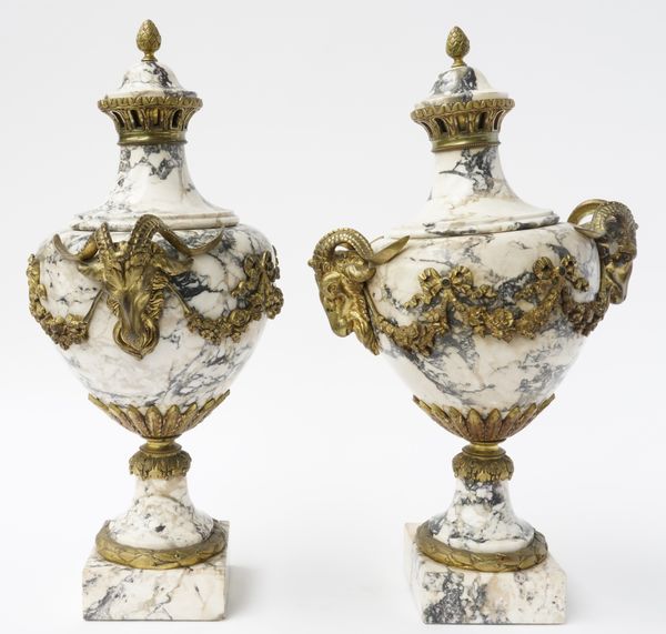 A PAIR OF LOUIS XVI STYLE BRECHE DI SERAVEZZA MARBLE GILT-METAL MOUNTED URNS (2)