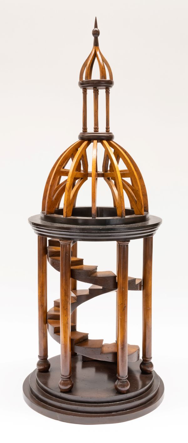 A ARCHITECTURAL MODEL OF A ROTUNDA WITH SPIRAL STAIRCASE