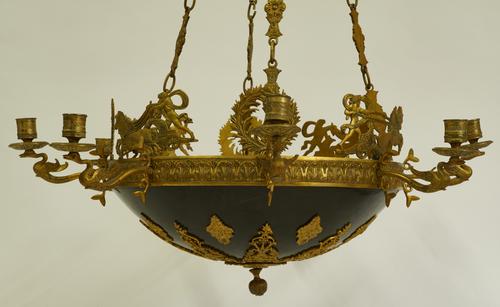 AN EMPIRE REVIVAL GILT AND PATINATED BRONZE EIGHT-LIGHT CHANDELIER