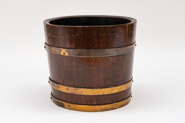 A BRASS-MOUNTED MAHOGANY BUCKET