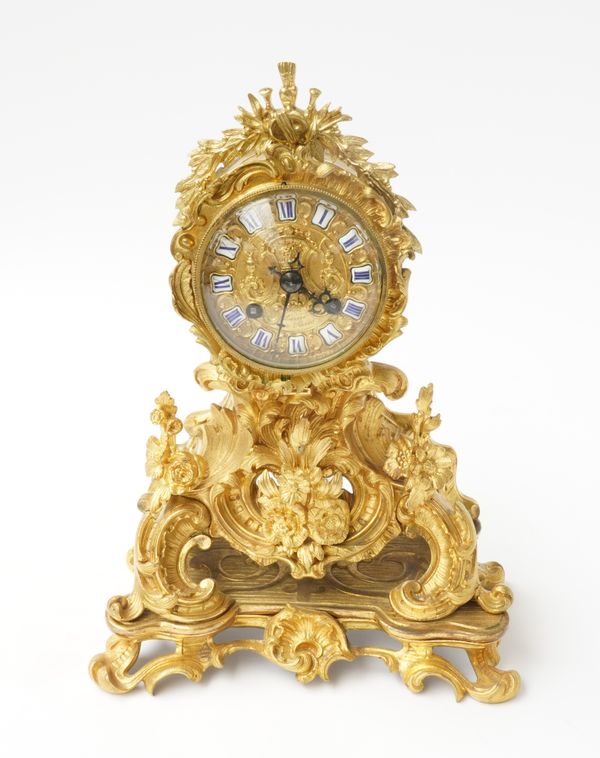 A FRENCH ROCOCO REVIVAL GILT-BRONZE STRIKING MANTEL CLOCK