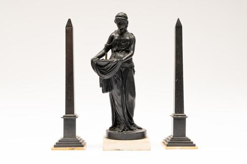 A PAIR OF FRENCH BLACK MARBLE OBELISKS AND A CLASSICAL MAIDEN (3)