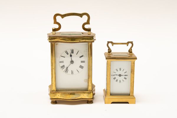 A FRENCH BRASS CASED CARRIAGE CLOCK AND ANOTHER SMALLER CARRIAGE CLOCK (2)