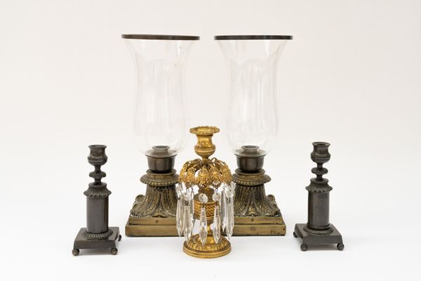 A PAIR OF REGENCY PATINATED BRASS CANDLESTICKS TOGETHER WITH A REGENCY GILT-BRASS AND LUSTRE MOUNTED CANDLESTICK (5)